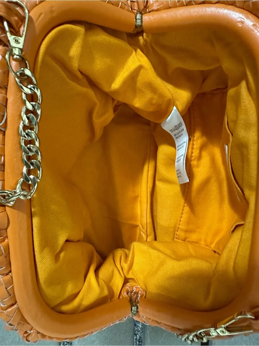 Anthropologie Frankie Faux leather braided clutch bag gold chain strap in orange